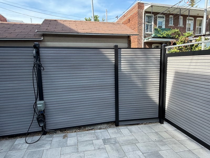 Composite privacy fence installation in Stone Grey — Stone Grey