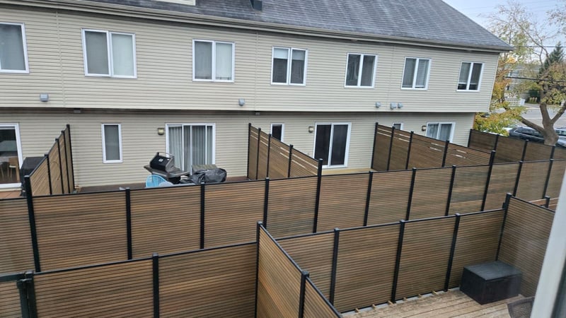 Composite privacy fence installation in Natural Brown — Natural Brown