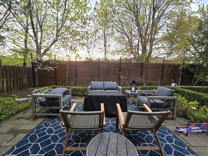 Composite privacy fence installation in Natural Brown — Natural Brown