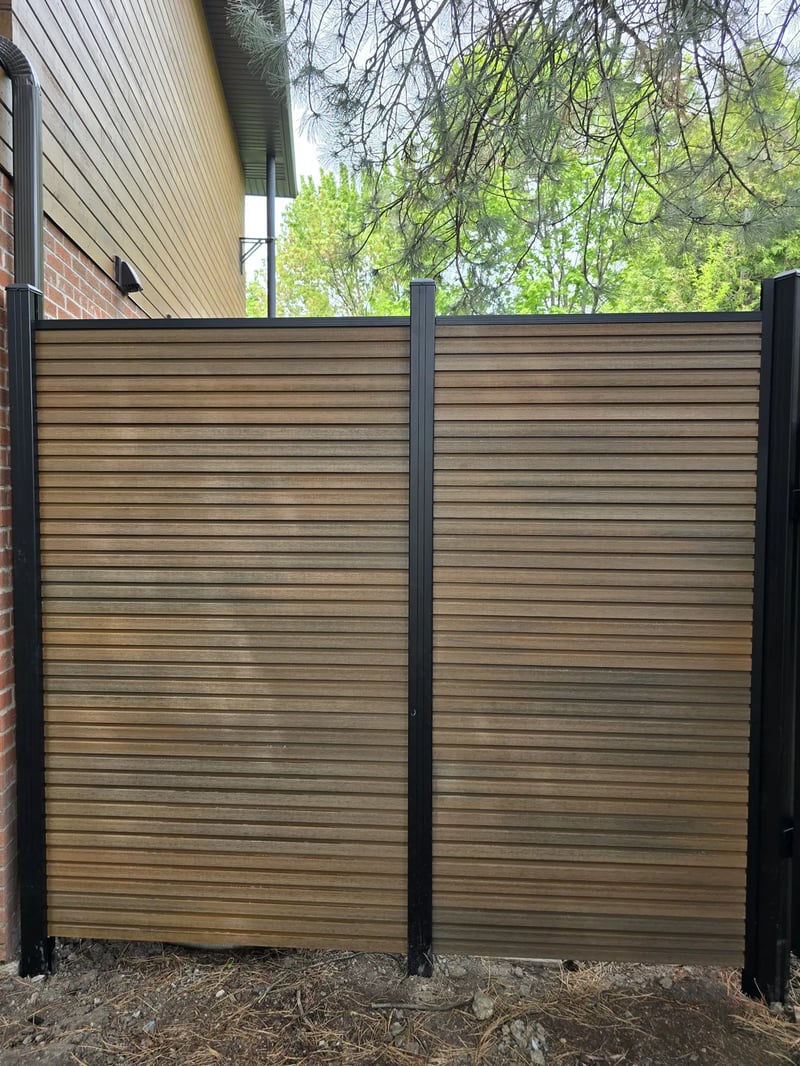 Composite privacy fence installation in Natural Brown — Natural Brown