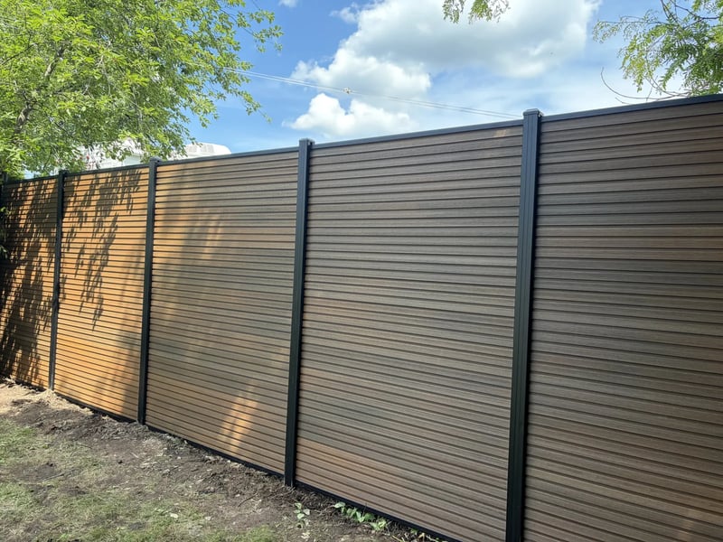 Composite privacy fence installation in Natural Brown — Natural Brown