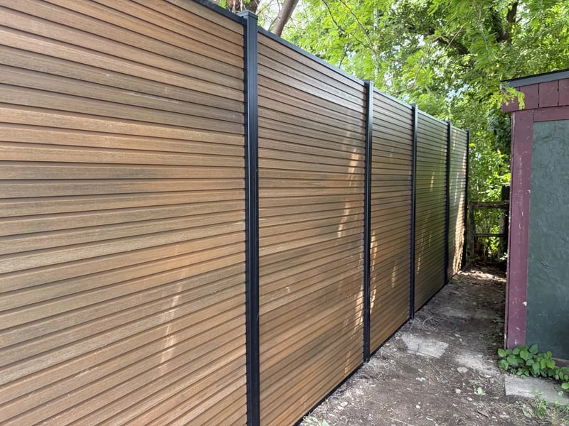 Composite privacy fence installation in Natural Brown — Natural Brown